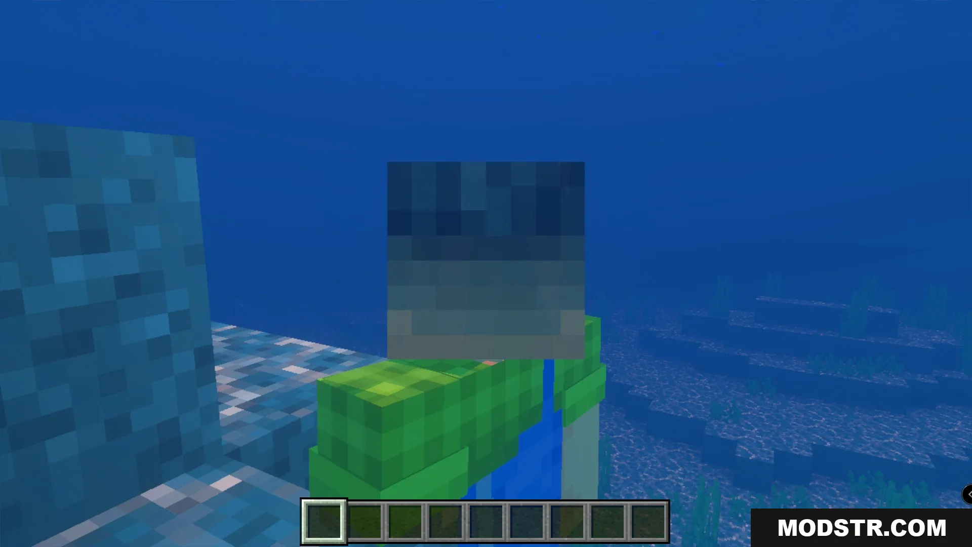 Minecraft player wearing a grey monster head while swimming in the deep ocean