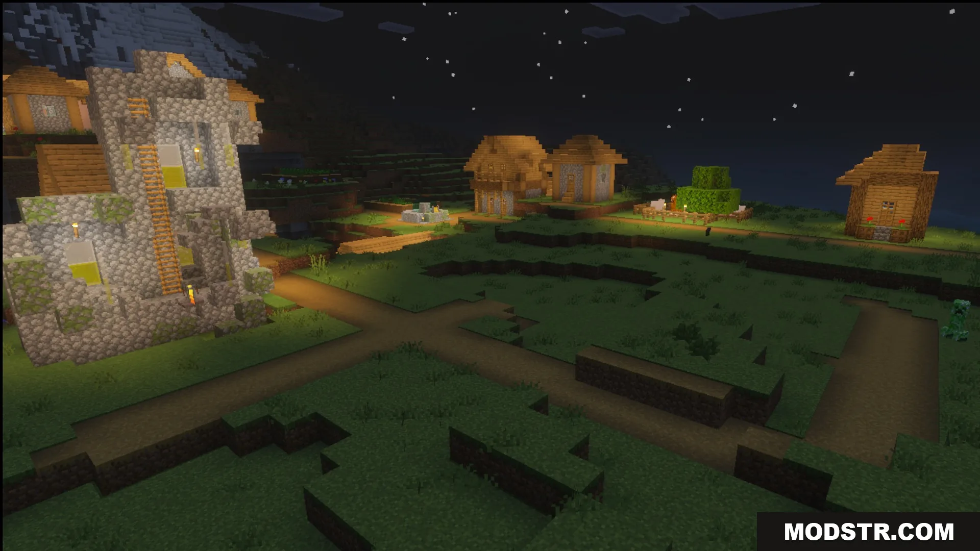 The village at night showing lighting and glowing blocks in the Ultimate Survival pack