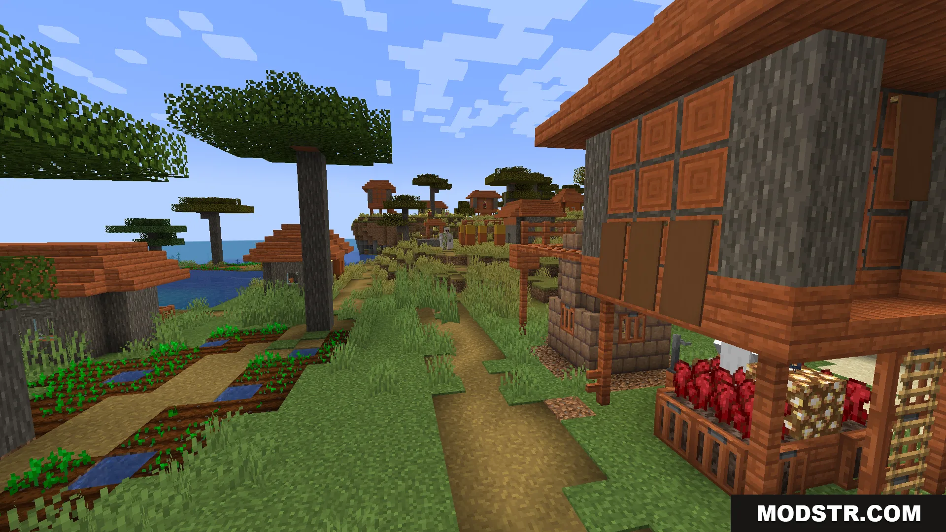 Savanna village with custom buildings and a villager walking on a path