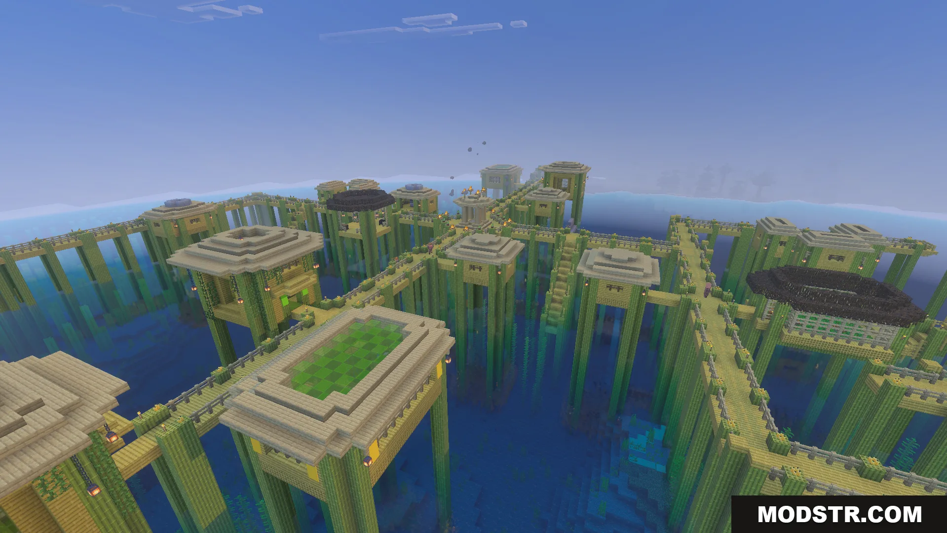 Villages Plus Addon Screenshot 2 Large village structure built on tall bamboo stilts over the ocean water
