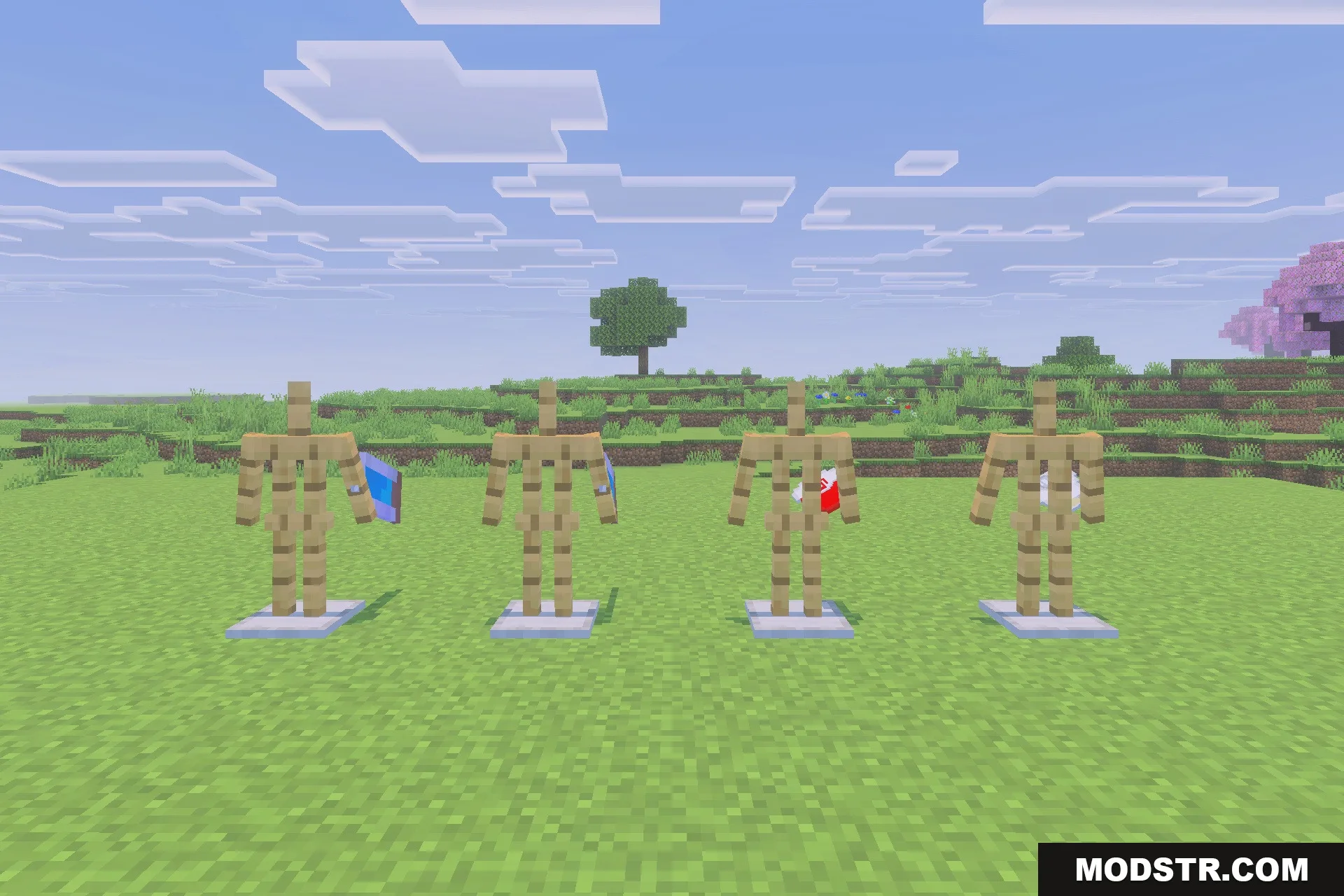 Viltrumite Addon Update Addon Screenshot 4 Four armor stands displaying various character suits and capes on the grass